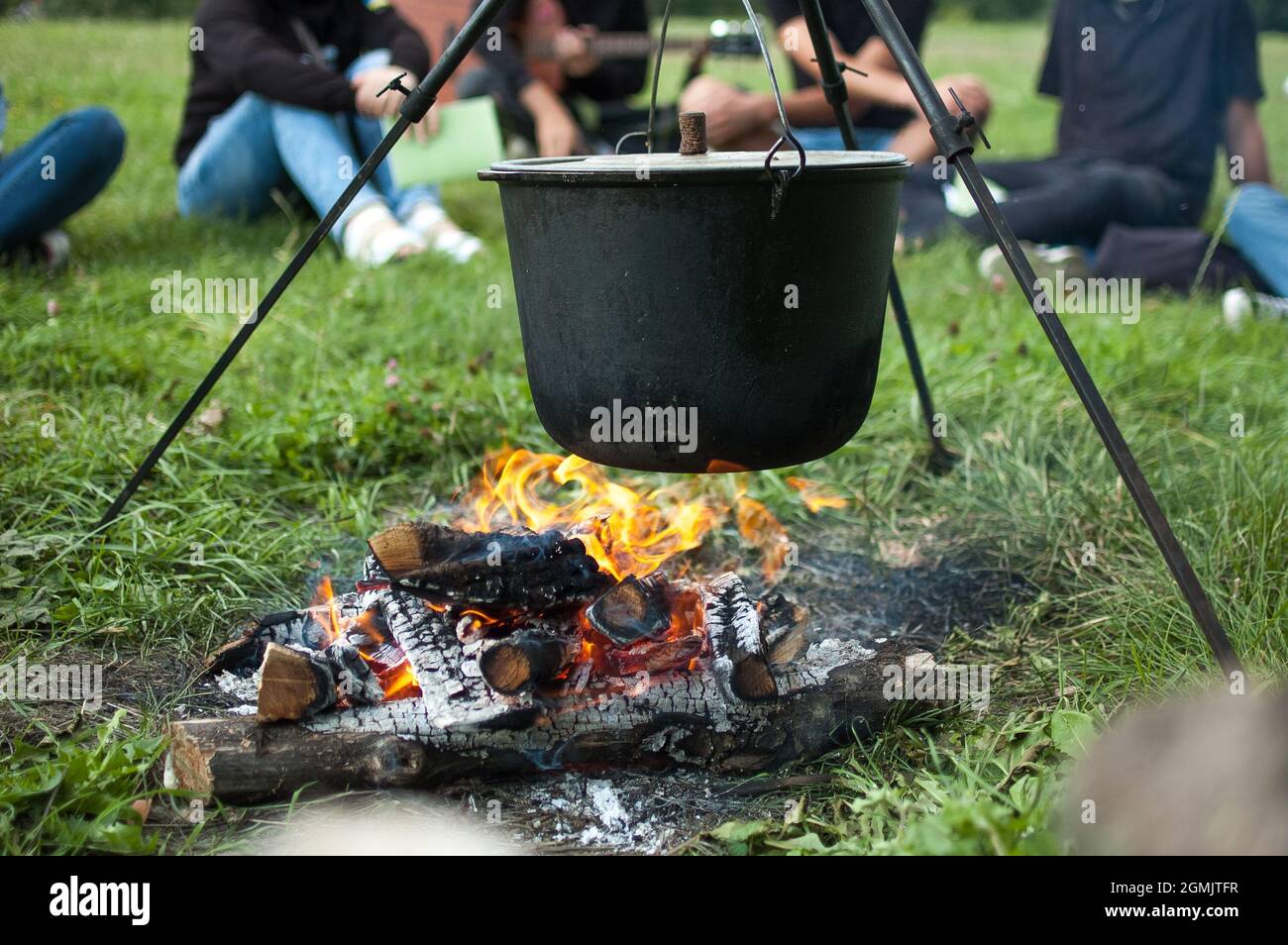 https://c8.alamy.com/comp/2GMJTFR/dark-big-pot-or-cauldron-cooking-pan-with-boiling-water-inside-above-the-fire-somewhere-in-the-park-or-mountains-camping-concept-2GMJTFR.jpg