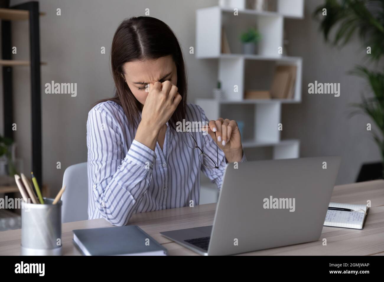 Woman taking off her glasses hires stock photography and images Alamy