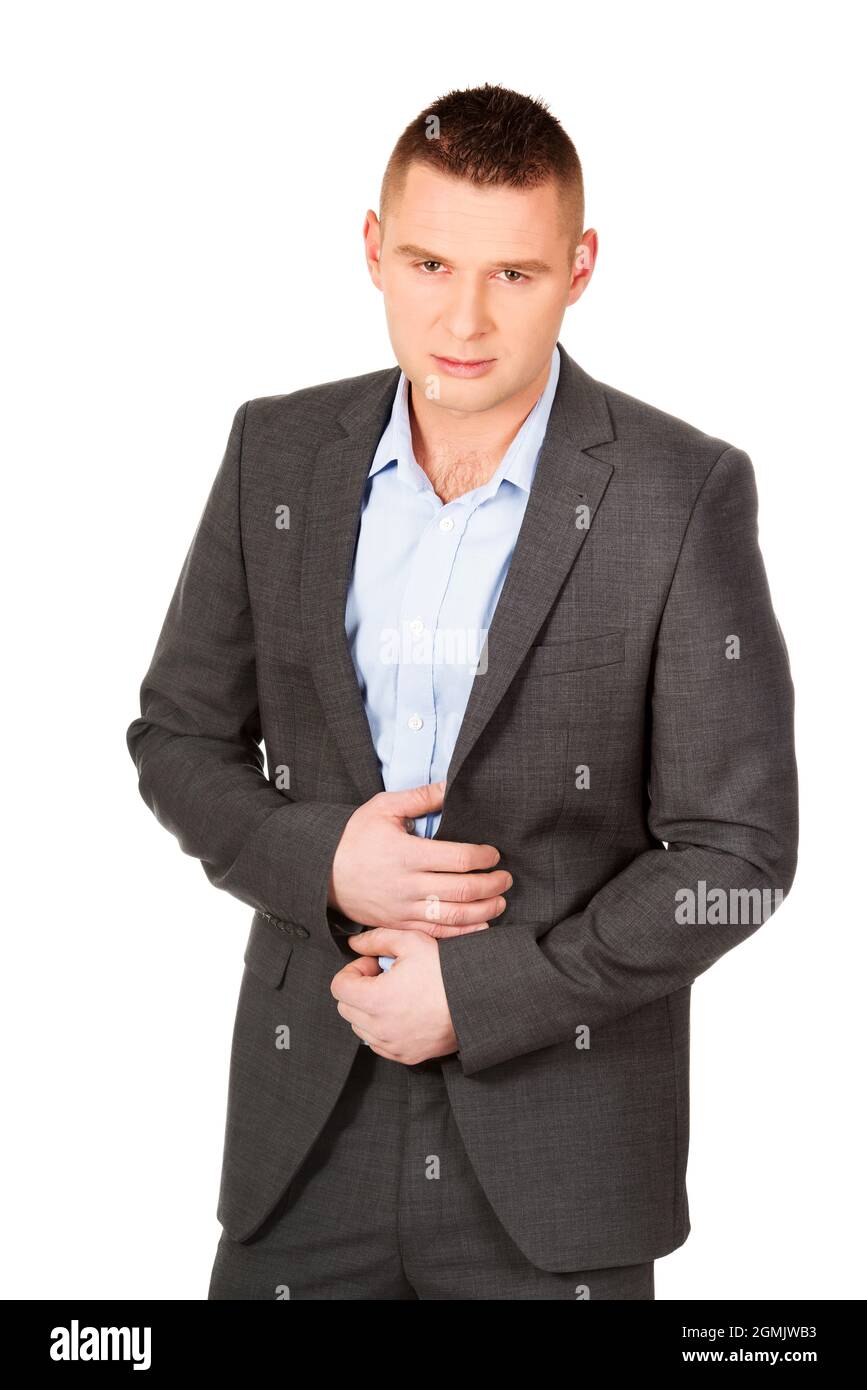 A young man wearing a suit and posing on a white background Stock Photo