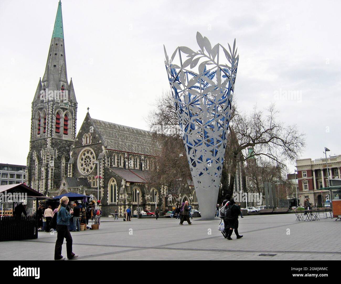 Cathedral Square, considered the center of Christchurch, New Zealand contains numerous landmarks including the historic ChristChruch Anglican Church and the modern public art nearby, The Chalice.  On February 22, 2011, an earthquake with the magnitude of 6.3 caused catastrophic damage to the landmark cathedral, the city, and the Canterbury region as a whole.  There were numerous aftershocks including the magnitude 6.0 aftershock on June 13, 2011.  Casualty estimates made this the fifth deadliest even in New Zealand history. The photo of Cathedral Square was taken on September 14, 2004. Stock Photo