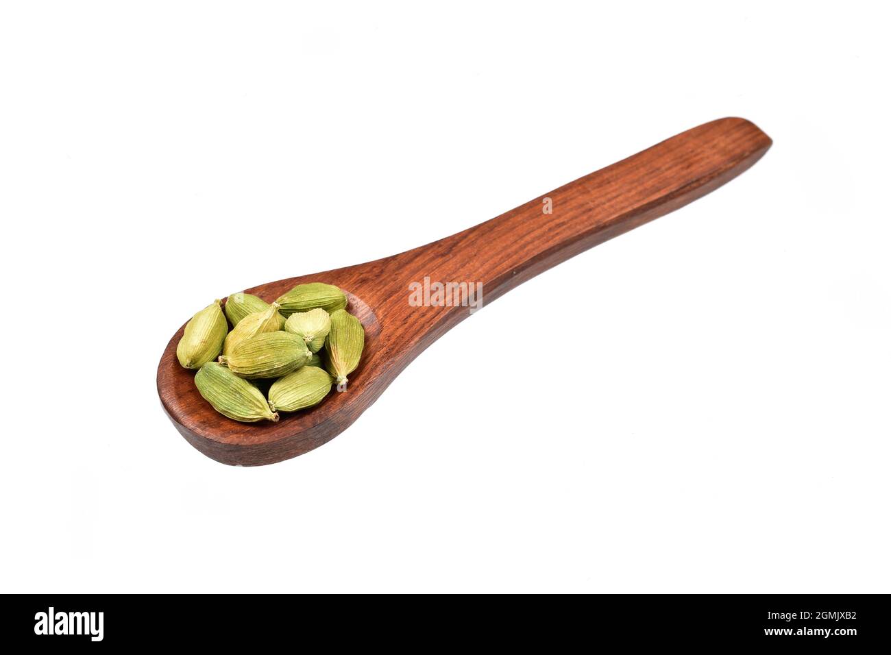 Cardamom in Wooden Spoon Isolated on White Background with Clipping Path Stock Photo