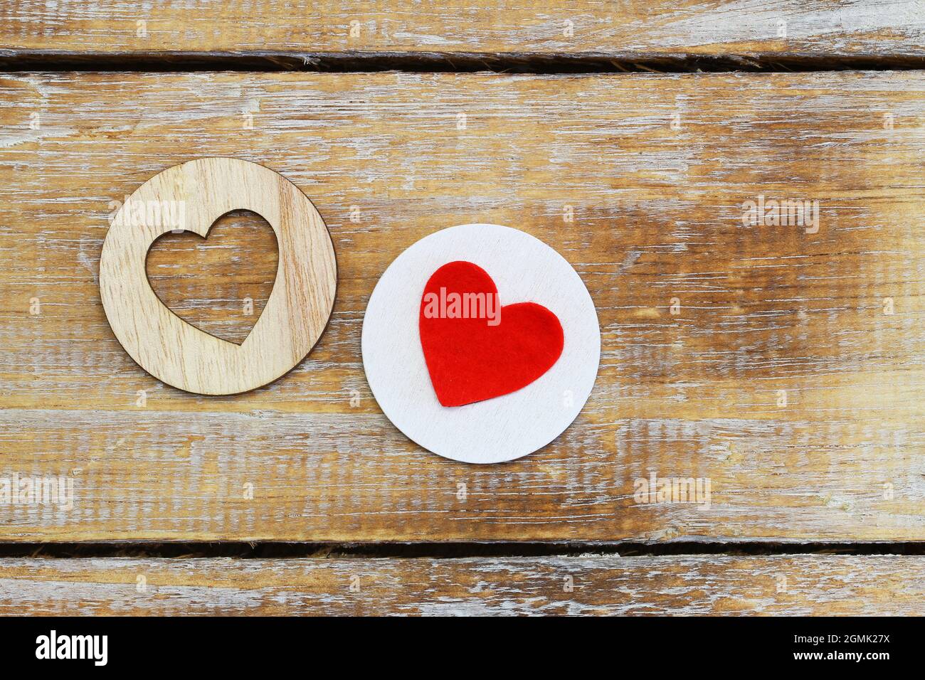 Two wooden hearts on rustic surface with copy space Stock Photo - Alamy