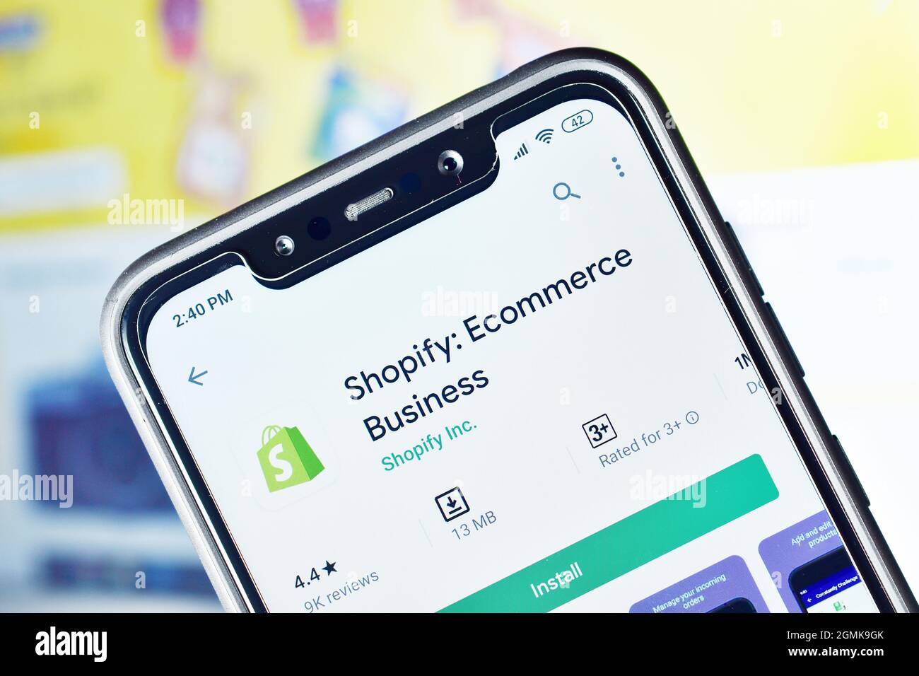 Shopify app on Smartphone, Shopify is Ecommerce Website Builder Stock Photo