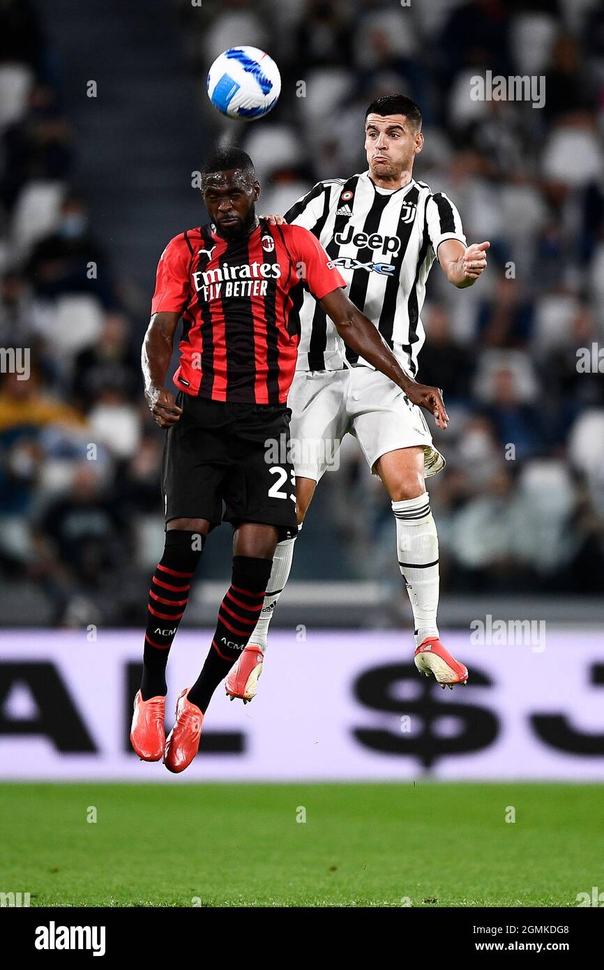 Turin, Italy. 19 September 2021. Fikayo Tomori (L) of AC Milan competes for a header with Alvaro Morata of Juventus FC during the Serie A football match between Juventus FC and AC Milan. Credit: Nicolò Campo/Alamy Live News Stock Photo