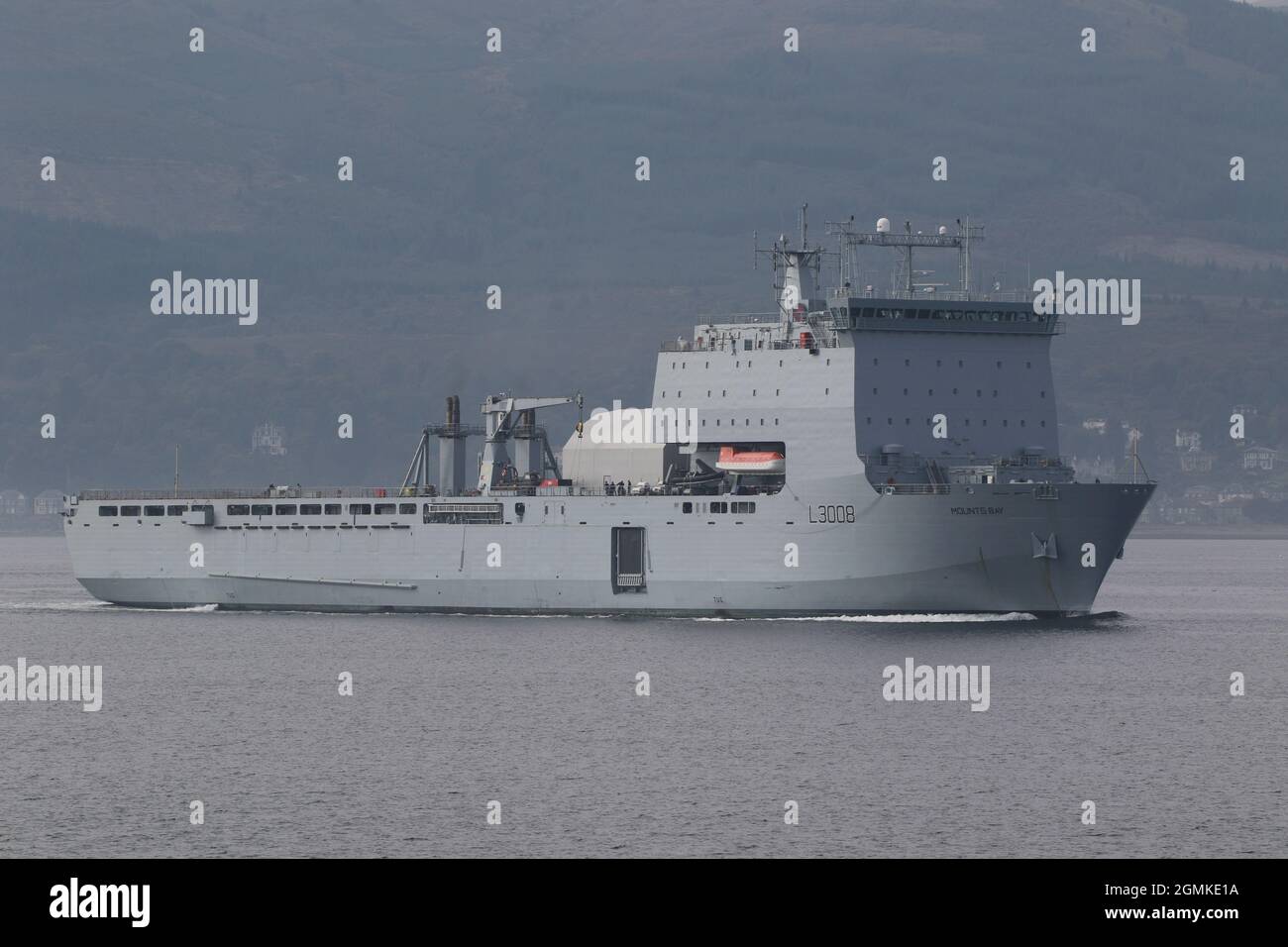 RFA Mounts Bay (L3008), a Bay-class landing ship dock operated by the Royal Fleet Auxiliary, passing Gourock on the Firth of Clyde, prior to participating in the military exercises Dynamic Mariner 2021 and Joint Warrior 21-2. Stock Photo