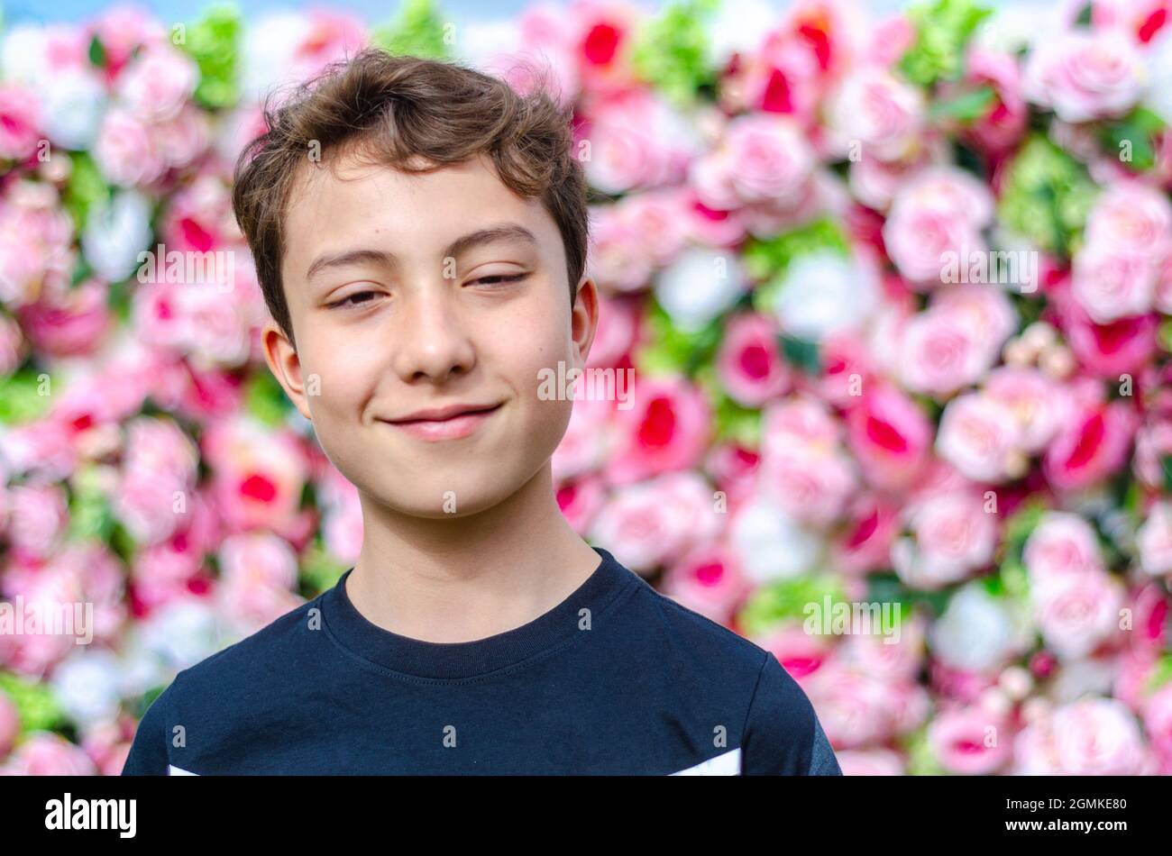 A portrait of a boy shot against a slower wall background. Stock Photo