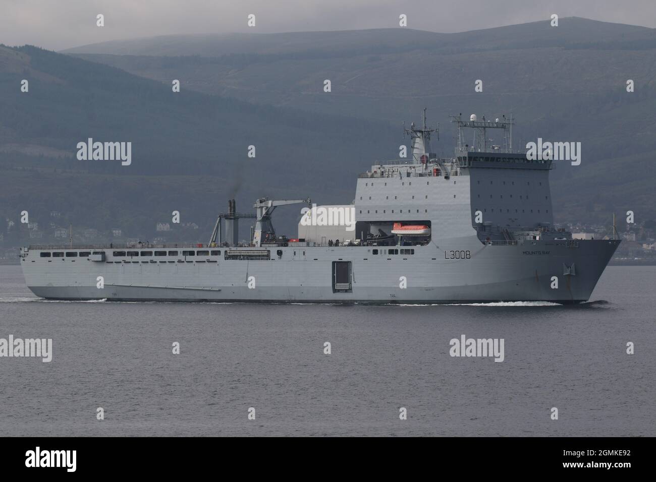 RFA Mounts Bay (L3008), a Bay-class landing ship dock operated by the Royal Fleet Auxiliary, passing Gourock on the Firth of Clyde, prior to participating in the military exercises Dynamic Mariner 2021 and Joint Warrior 21-2. Stock Photo