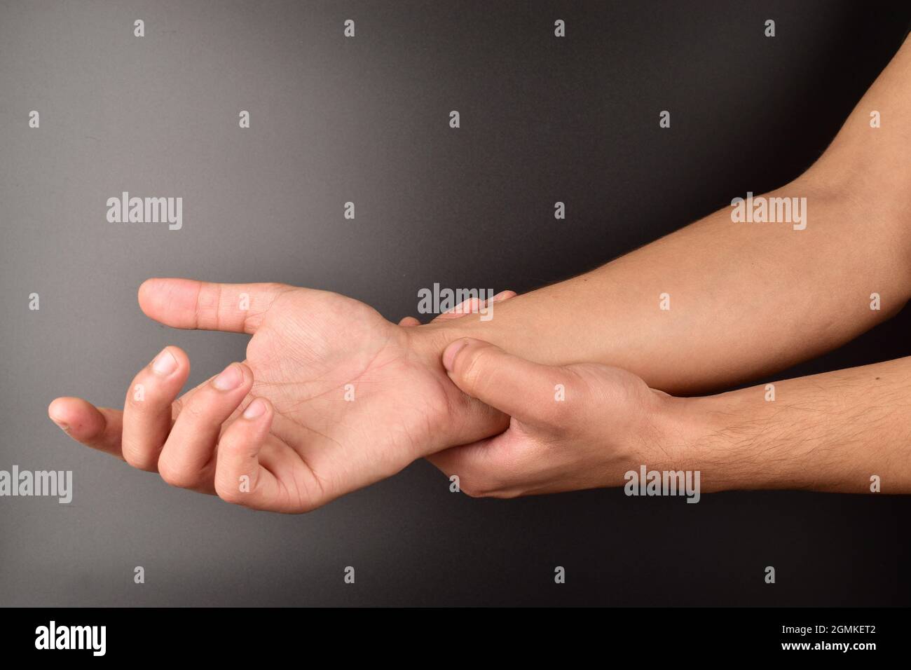 acupressure, hand doing self treatment, acupressure on black background Stock Photo