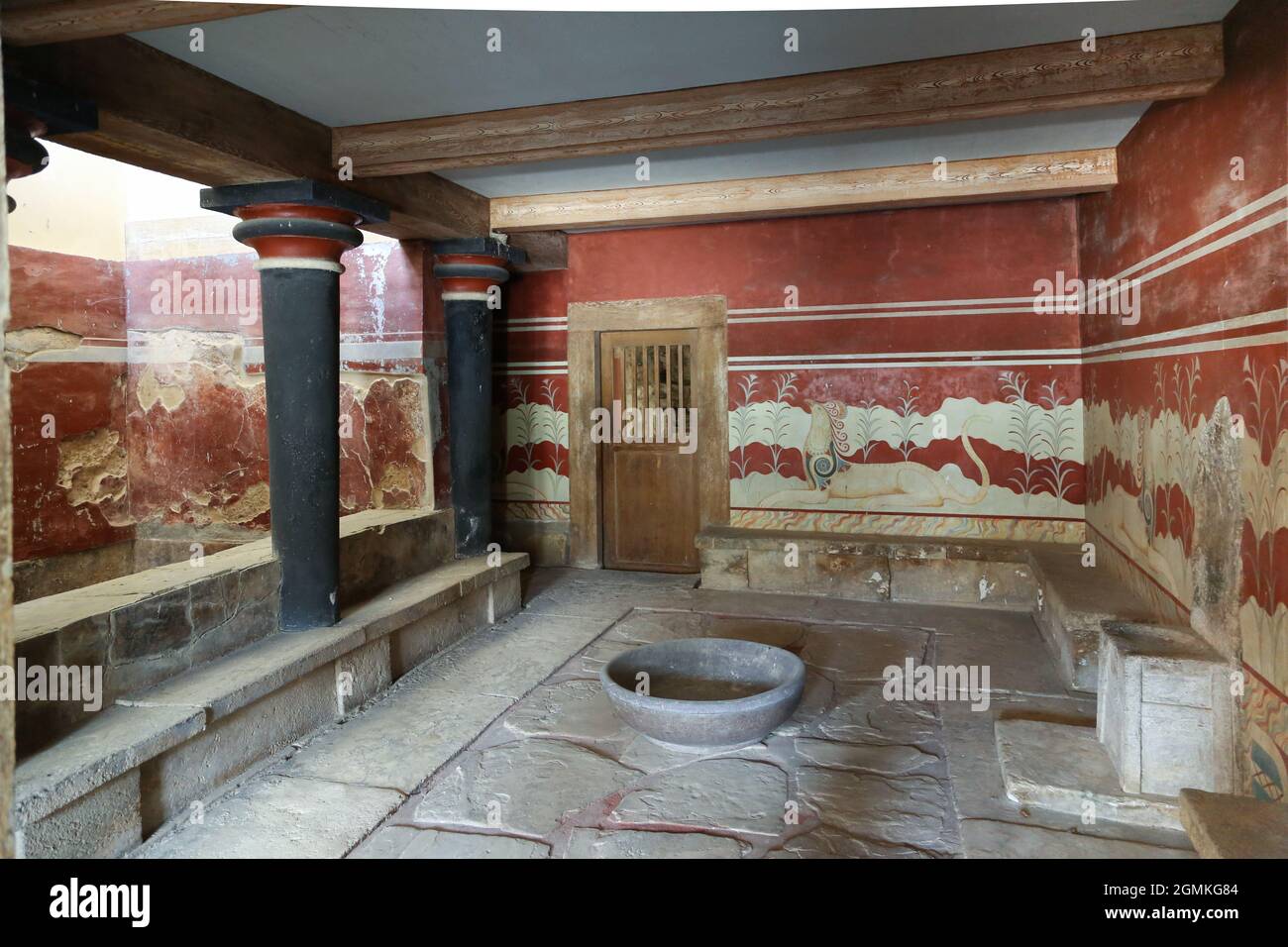 The bath at the Minoan Palace of Knossos on the Greek island of Crete is a Bronze Age archaeological site south of the the port city at Heraklion. Stock Photo