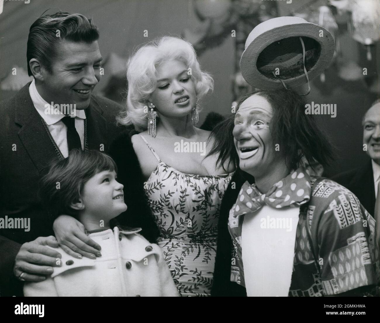 Oct. 10, 1959 -  London, England, United Kingdom - Among the guests at the Charity Performance of the Billy Smart Circus at Clapham Common last night was film star JAYNE MANSFIELD and her family, including her husband MICKEY HARGITAY, and daughter JAYNE MARIE (from her first marriage). The family joke with Coco the Clown at the Circus last night.  (Credit Image: © Keystone Press Agency/ZUMA Wire) Stock Photo