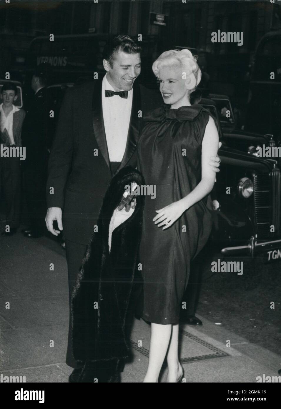 Jul. 07, 1958 - London, England, United Kingdom - JAYNE MANSFIELD, right, with her husband MICKEY HARGITAY, arrive at the Carlton, Hay market 1st, attend the premiere of the film ''The Battle of the V.l.''(Missiles From Hell). Mansfield, who wore a sack-style dress, yesterday announced that she is expecting a baby in December.  (Credit Image: © Keystone Press Agency/ZUMA Wire) Stock Photo