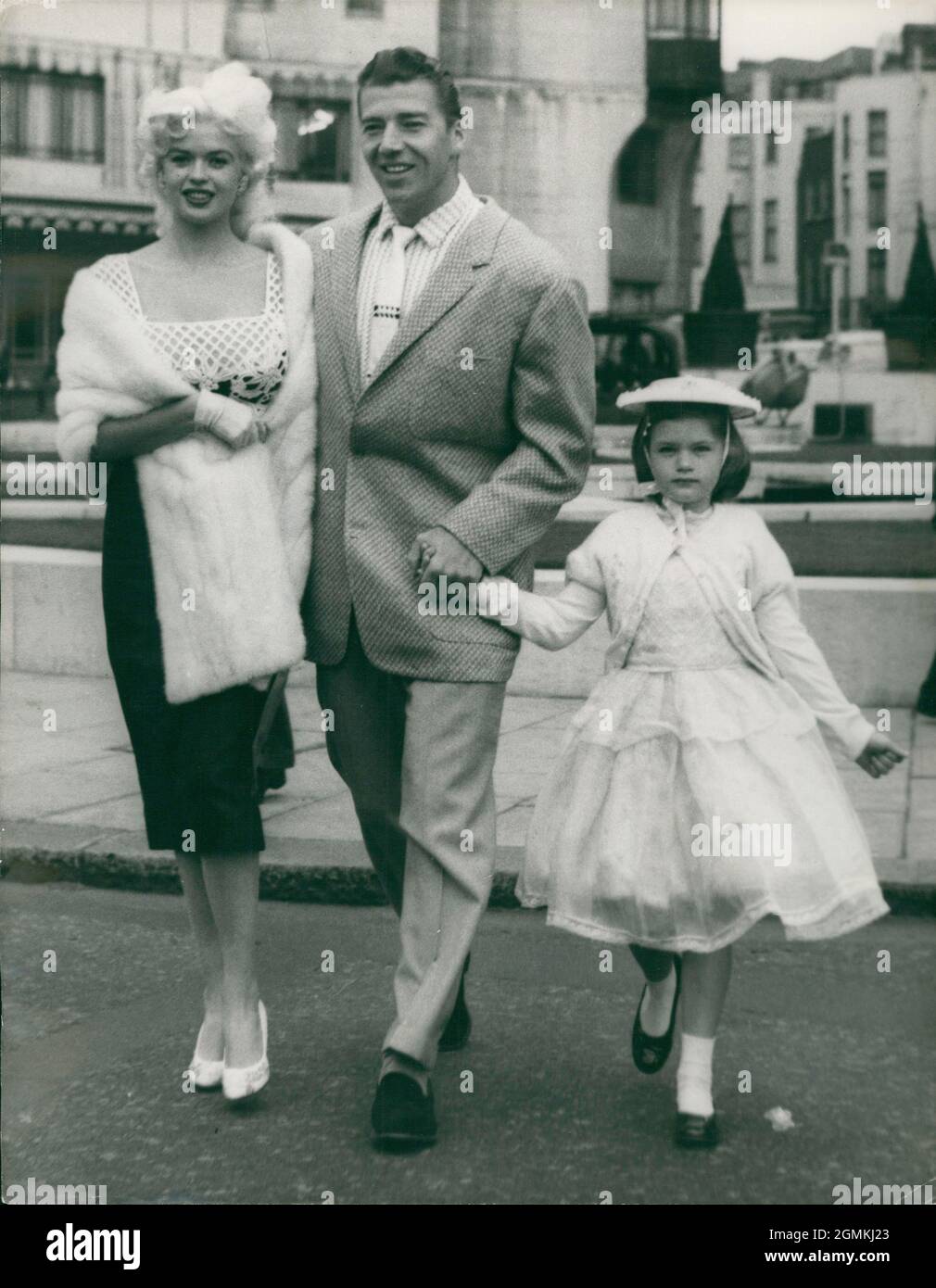 Apr. 04, 1958 - London, England, United Kingdom - Star JAYNE MANSFIELD, left,  and husband former Mr. Universe - MICKEY HARGITAY, and Mansfield's eight year-old daughter by an earlier marriage JAYNE MARIE, in London yesterday. Mansfield is here for filming 'The Sheriff of Fractured Jaw'.  (Credit Image: © Keystone Press Agency/ZUMA Wire) Stock Photo