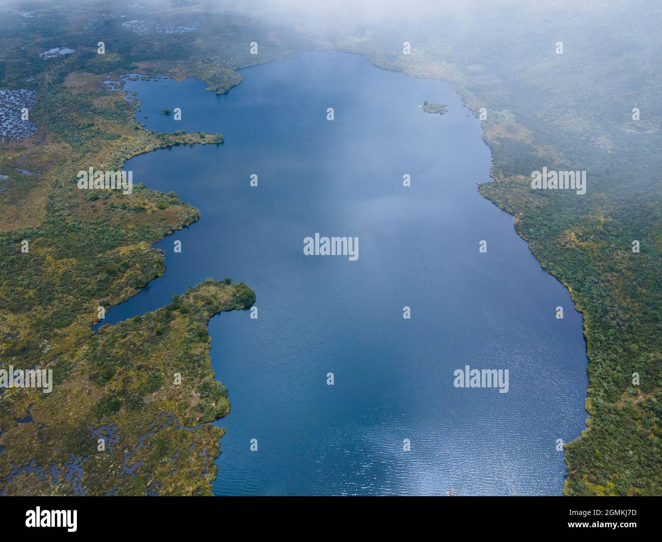 An aerial view of a lake surrounded by lush nature Stock Photo - Alamy