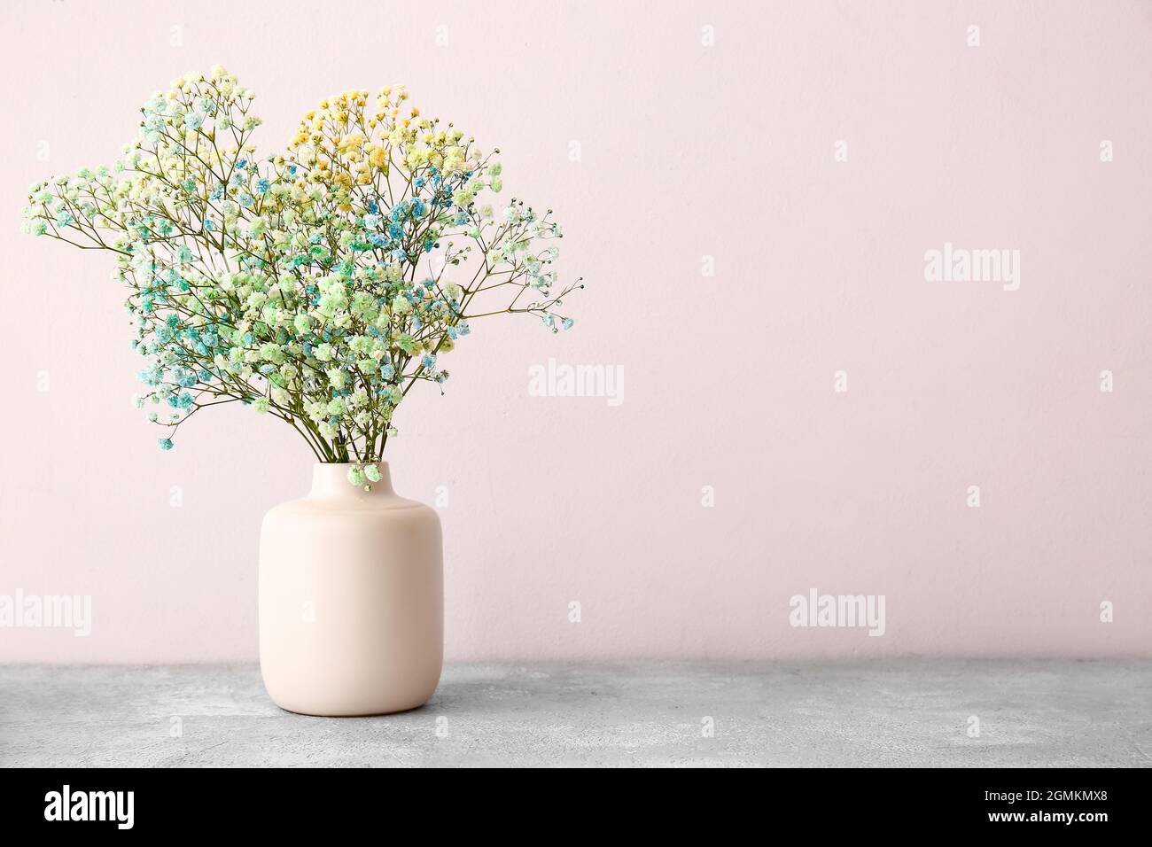 Vase with beautiful gypsophila flowers on table Stock Photo - Alamy