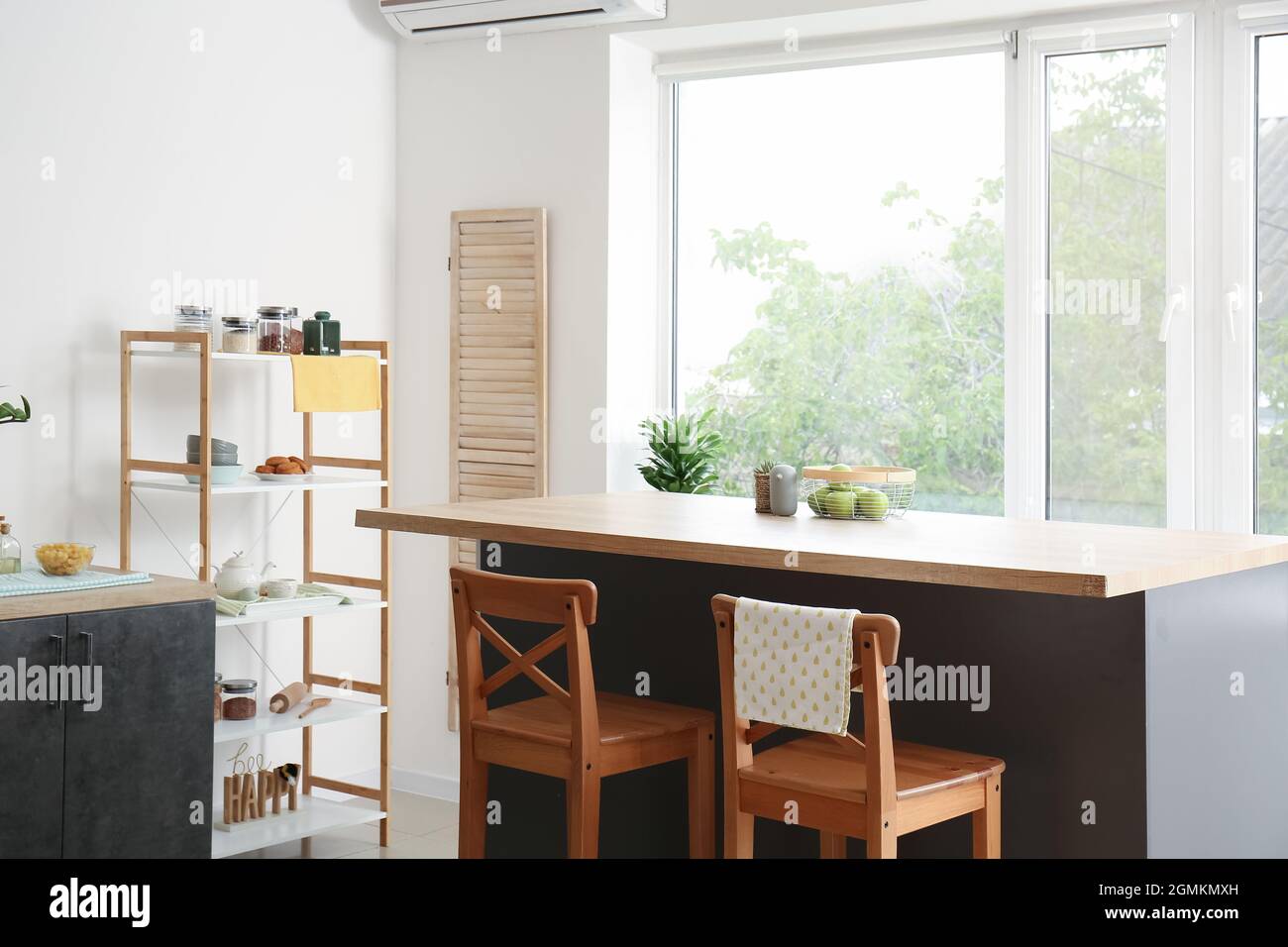 Interior of stylish kitchen with dining table and chairs Stock Photo ...
