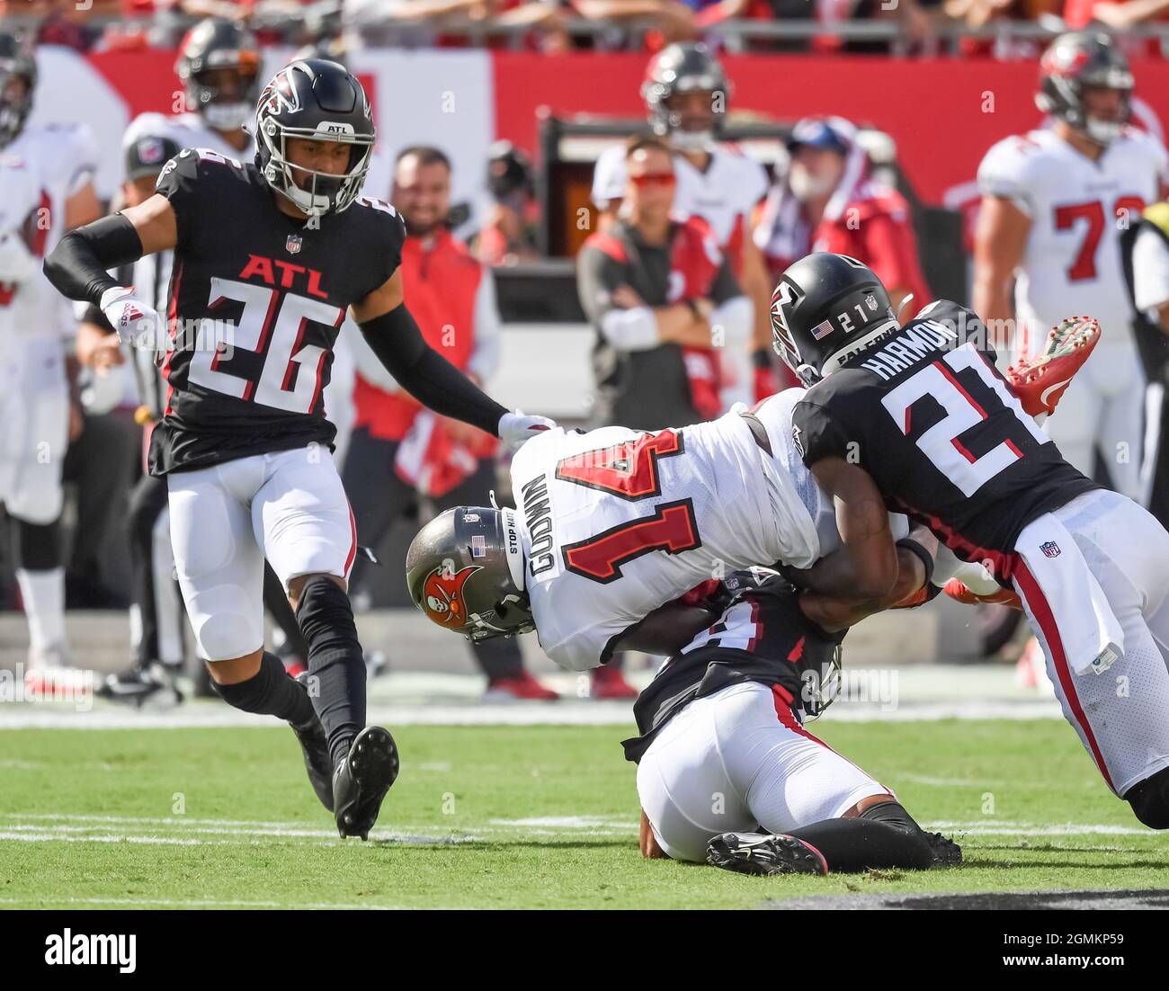 Tampa, United States. 19th Sep, 2021. Atlanta Falcons' Isaiah Oliver (26) and Duron Harmon (21) upend Tampa Bay Buccaneers' Chris Godwin (14) during the first quarter at Raymond James Stadium in Tampa, Florida on Sunday, September 19, 2021. Photo by Steve Nesius/UPI Credit: UPI/Alamy Live News Stock Photo