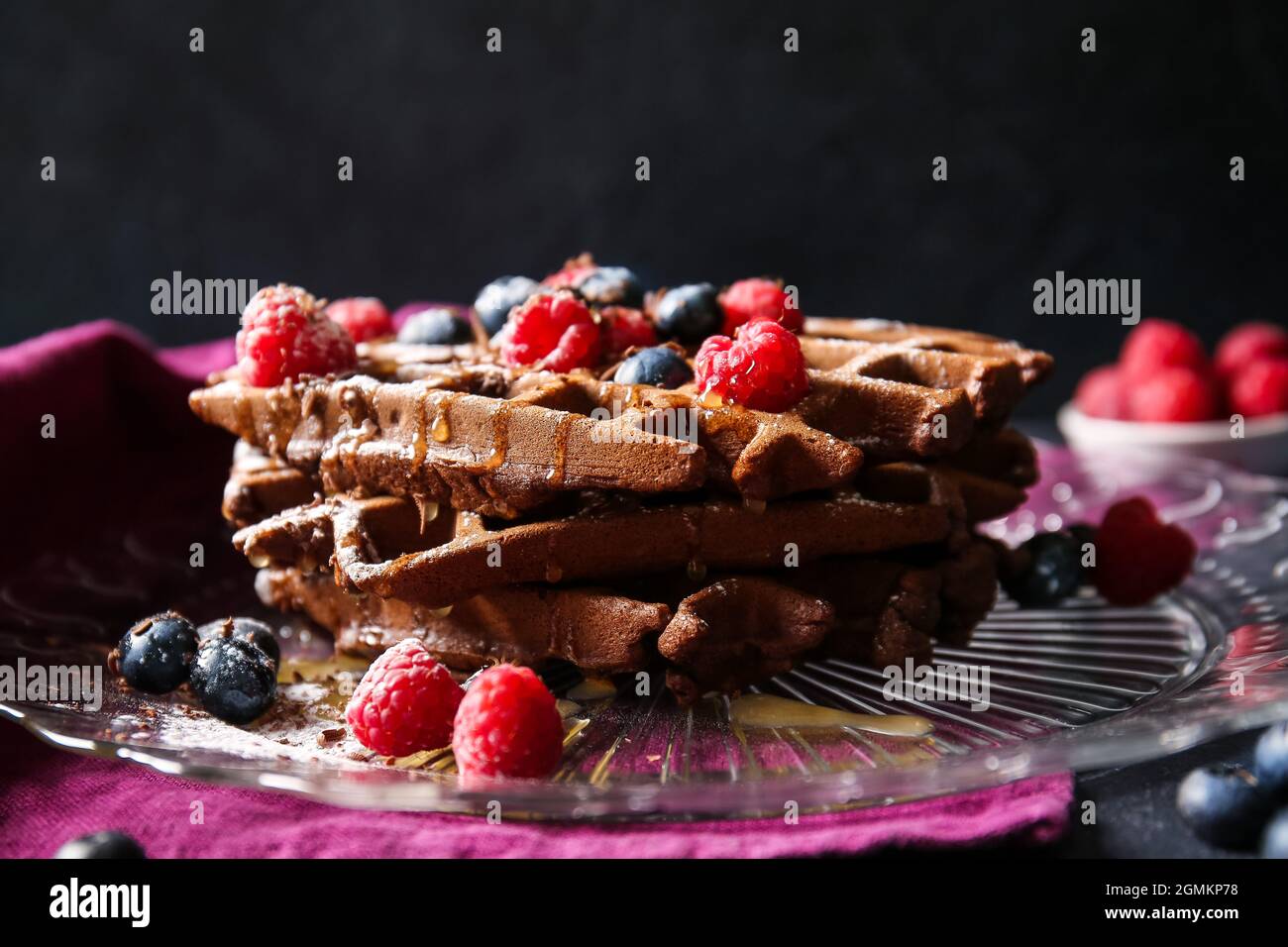 Plate of delicious Chocolate Belgian Waffles with berries on black ...