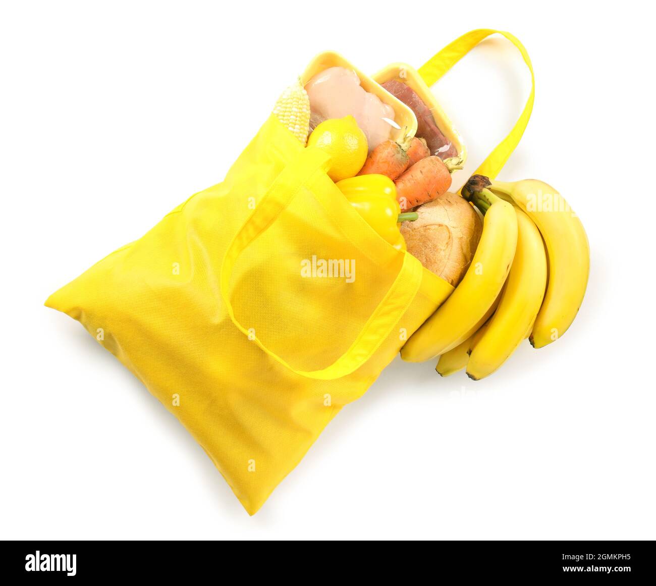 Bright Eco bag with scattered products on white background Stock Photo