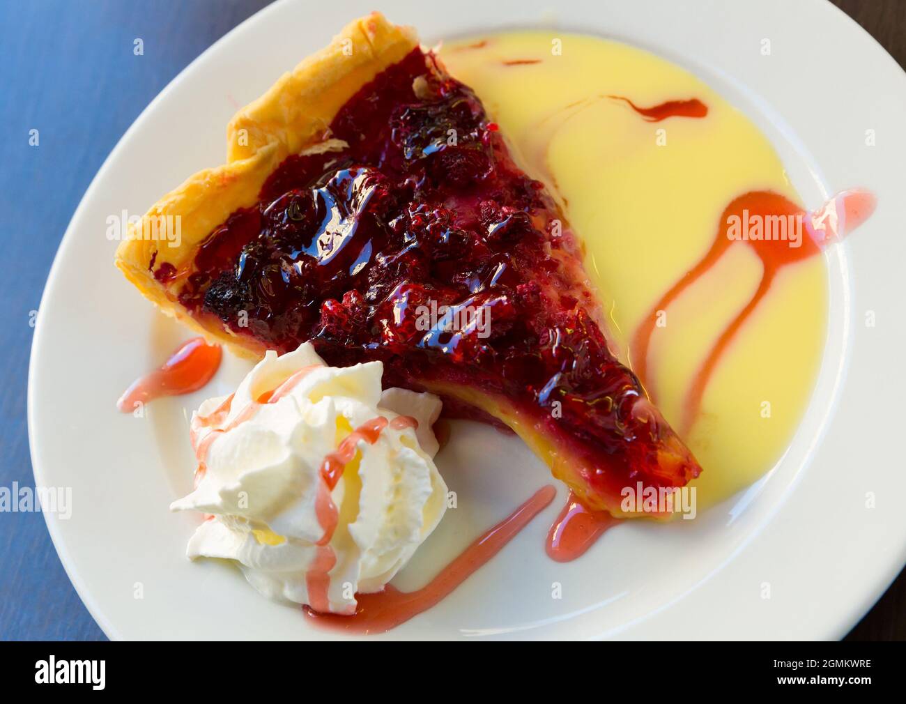 Raspberry quiche with whipped cream Stock Photo Alamy