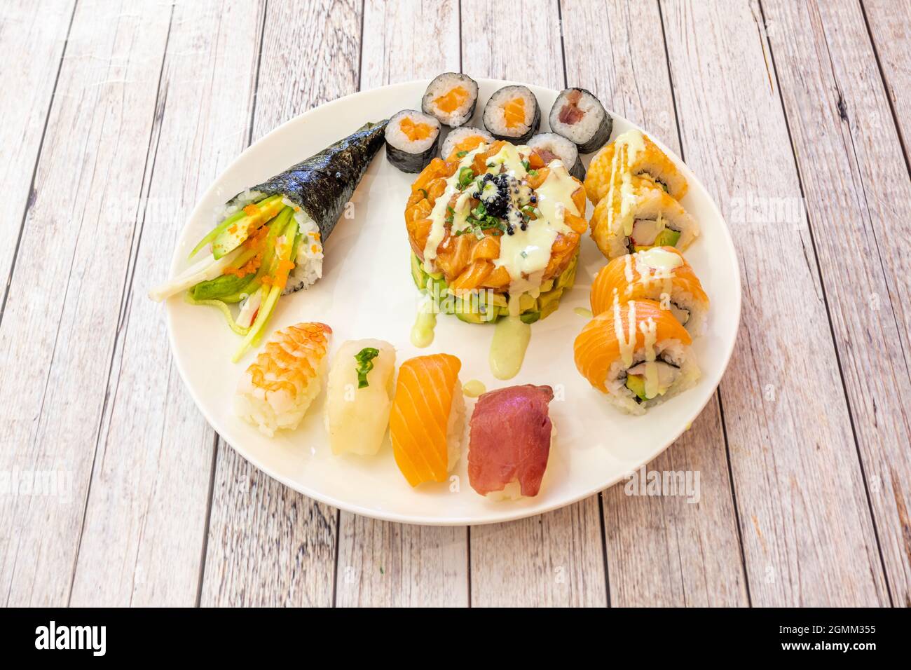 Assorted Japanese sushi with bluefin tuna nigiri, uramaki and avocado