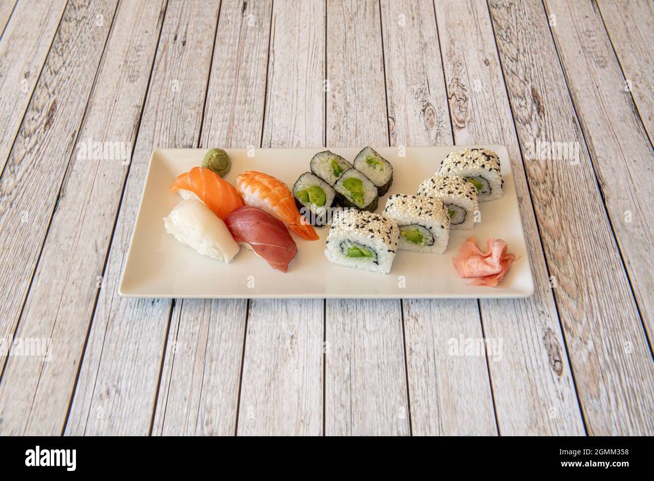 Assorted sushi platter with uramaki california roll with avocado and