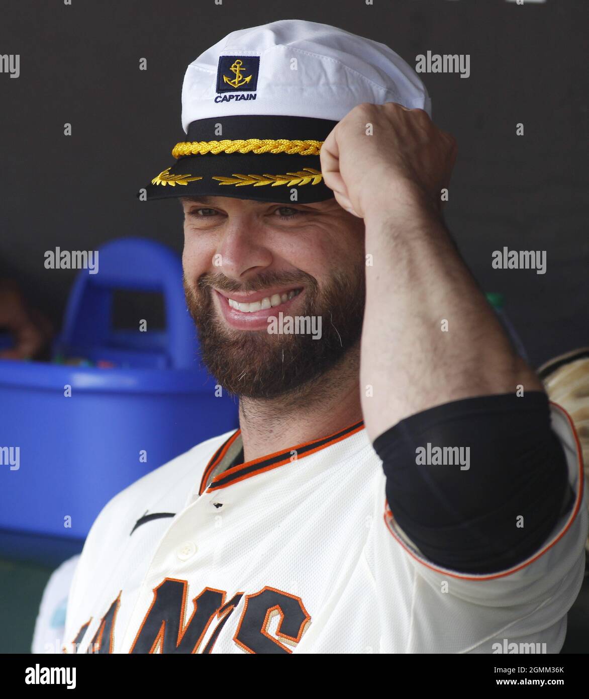 San Francisco, United States. 19th Sep, 2021. San Francisco Giants Brandon  Belt wears a captain's cap in the dugout before a game against the Atlanta  Braves at Oracle Park on Sunday, September