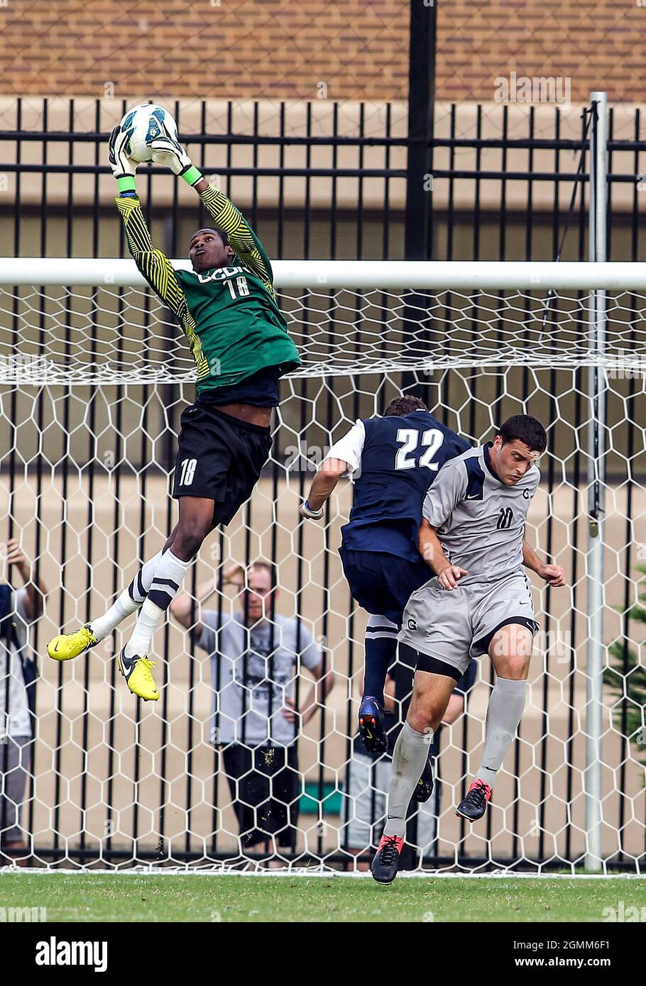 October 03 2012: Brandon Allen (10) of Georgetown University is beaten ...