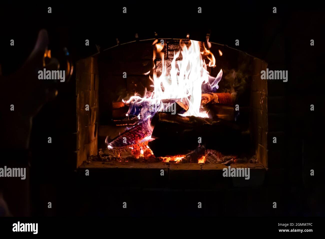 view of the flames of a fire in a home fireplace with dry wood Stock Photo