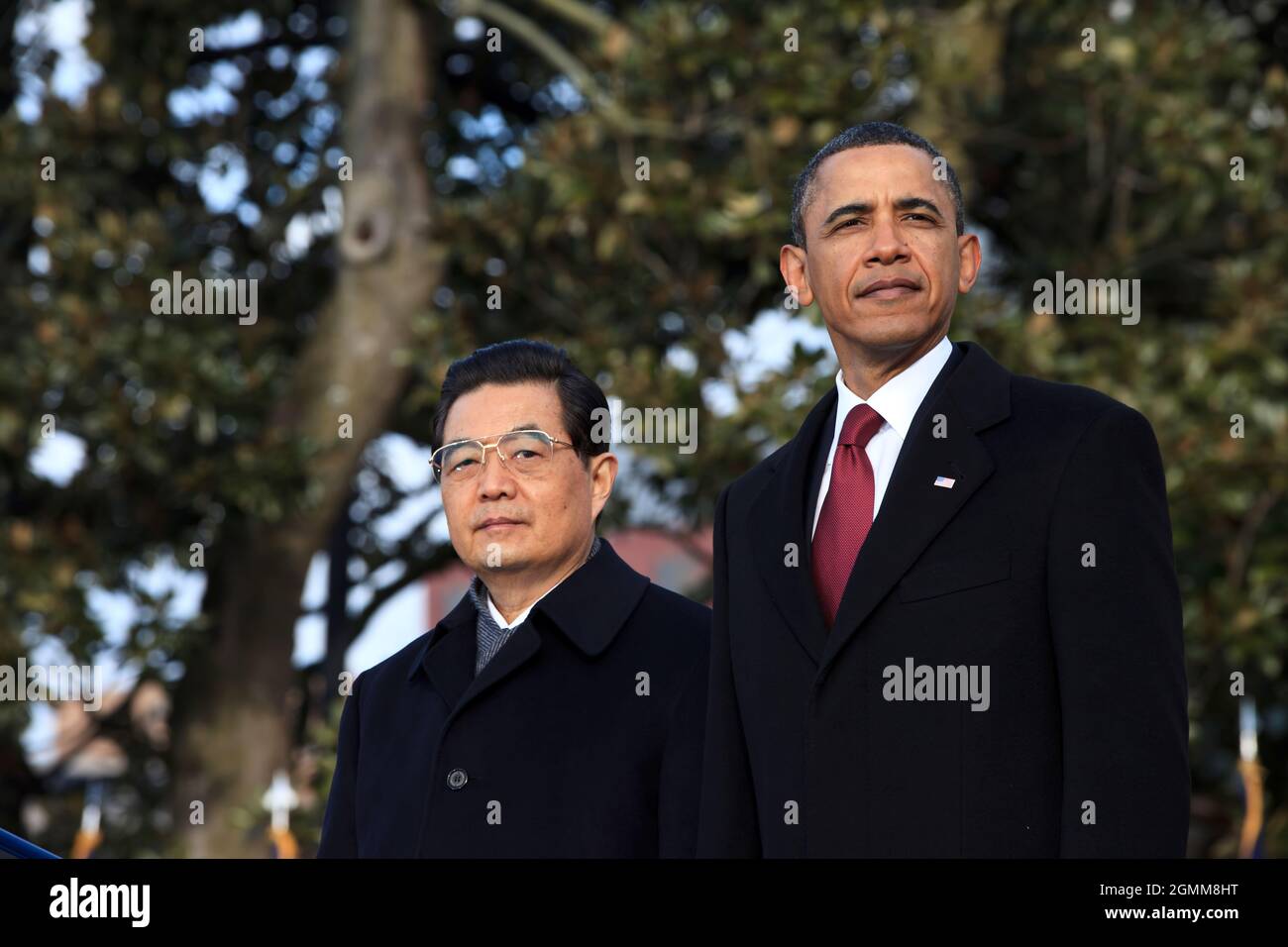 President Barack Obama and President Hu Jintao of China watch the United States Army Old Guard Fife and Drum Corps pass on the South Lawn of the White House, Jan. 19, 2011. (Official White House Photo by Pete Souza) This official White House photograph is being made available only for publication by news organizations and/or for personal use printing by the subject(s) of the photograph. The photograph may not be manipulated in any way and may not be used in commercial or political materials, advertisements, emails, products, promotions that in any way suggests approval or endorsement of the Pr Stock Photo