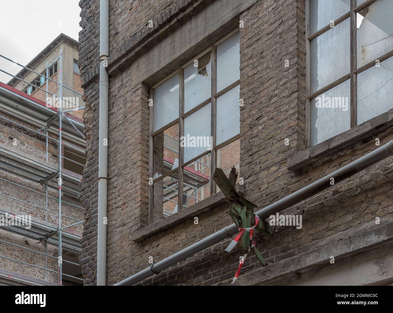 broken windows in an old ruined factory Stock Photo