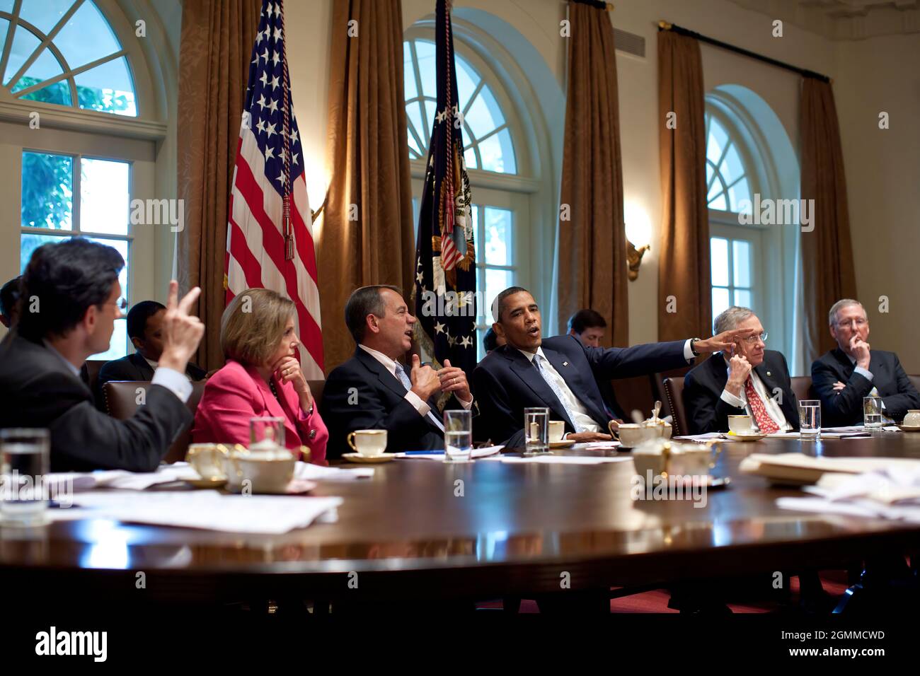 President Barack Obama meets with Congressional Leadership in the Cabinet Room of the White House to discuss ongoing efforts to find a balanced approach to the debt limit and deficit reduction, July 13, 2011. Pictured, from left, are: House Majority Leader Eric Cantor, House Minority Leader Nancy Pelosi, House Speaker John Boehner, Senate Majority Leader Harry Reid, and Senate Minority Leader Mitch McConnell. (Official White House Photo by Pete Souza) This official White House photograph is being made available only for publication by news organizations and/or for personal use printing by the Stock Photo