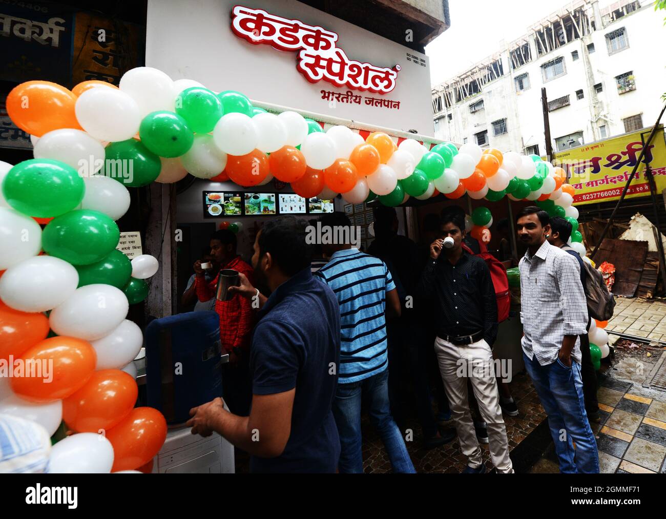 A tea shop decorated with Indian flag colors balloons celebrating India's Independence day. Pune, India. Stock Photo