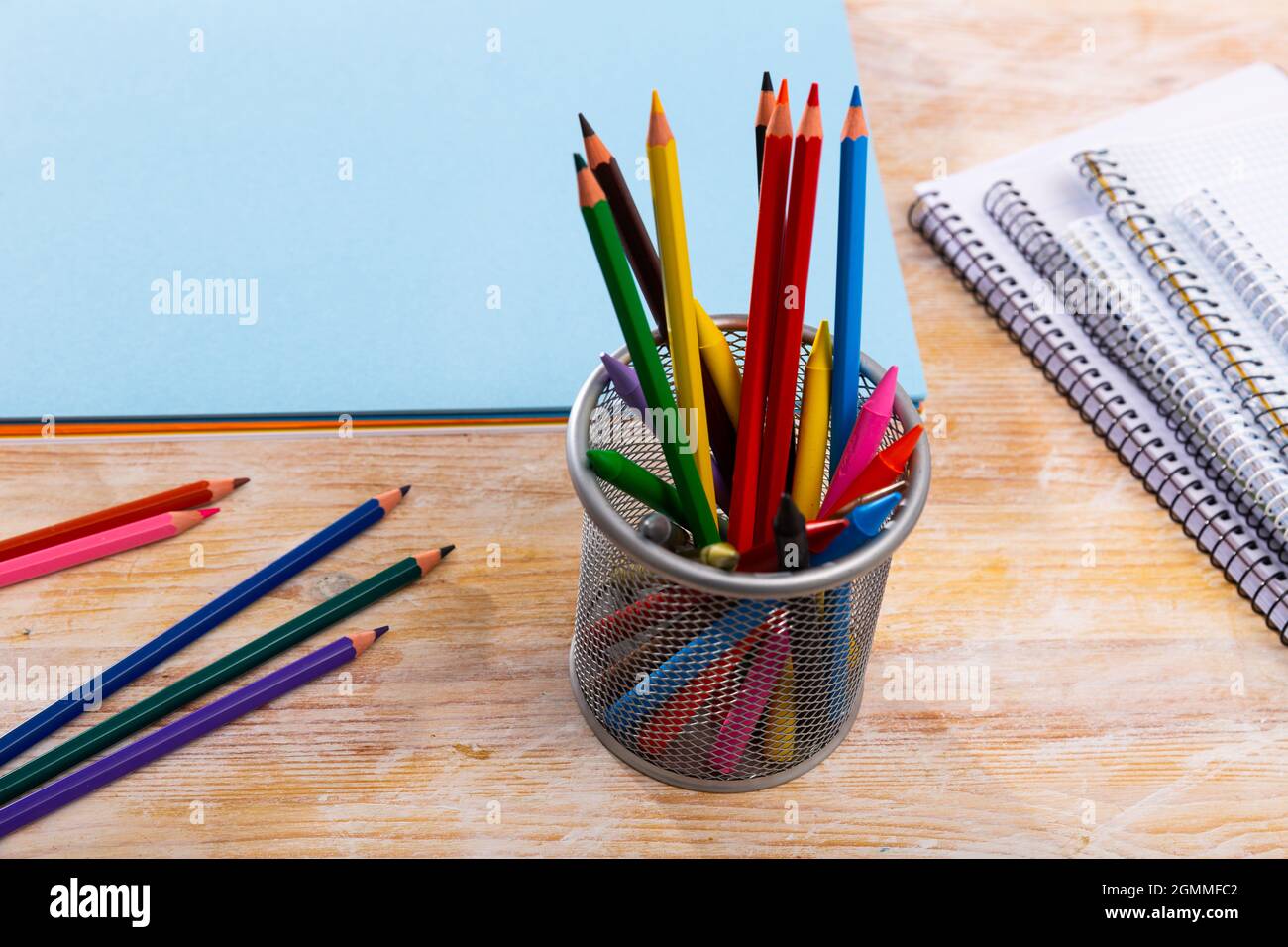 Colored pencils kept in pencil holder Stock Photo