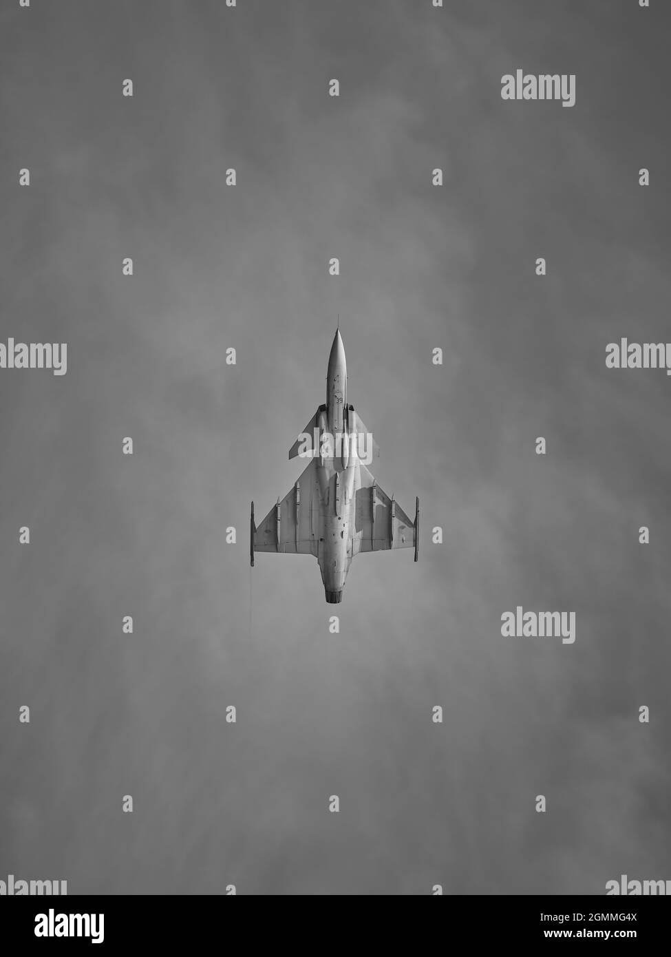 Fighter flying straight up in black and white Stock Photo