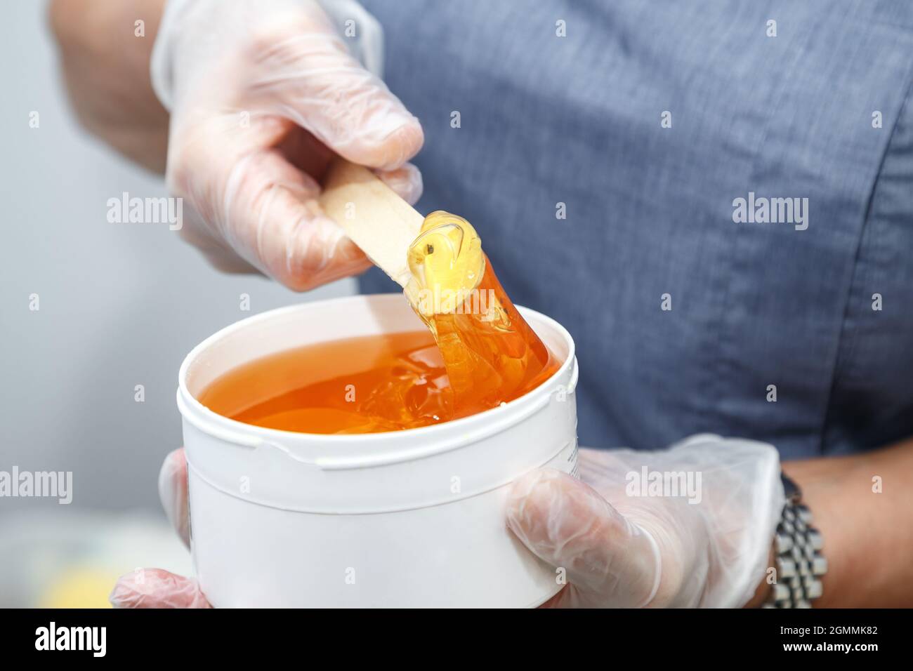 Image of melted wax on wooden stick for depilation Stock Photo Alamy