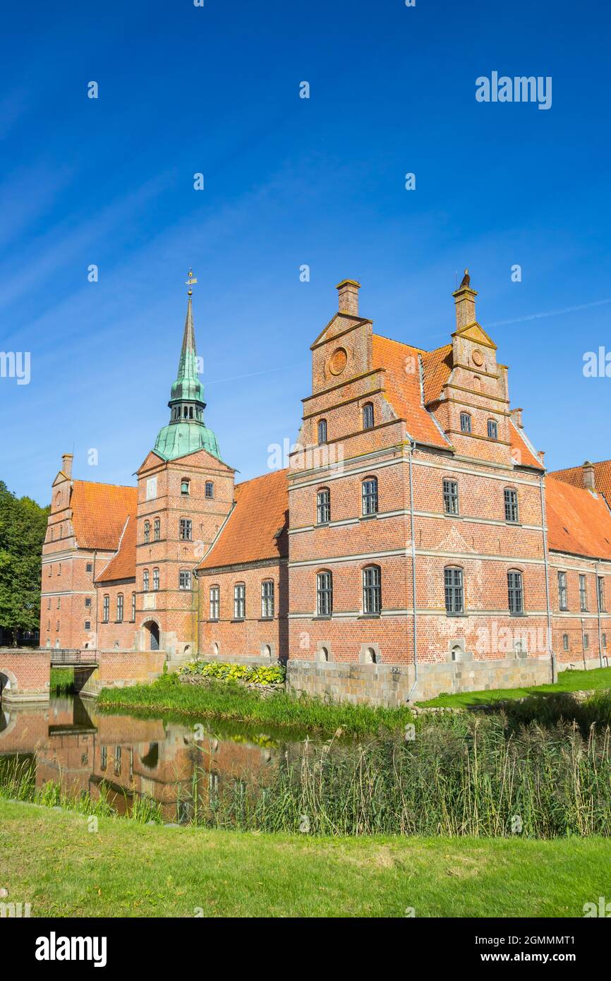 Historic castle surrounded by water in Rosenholm, Denmark Stock Photo