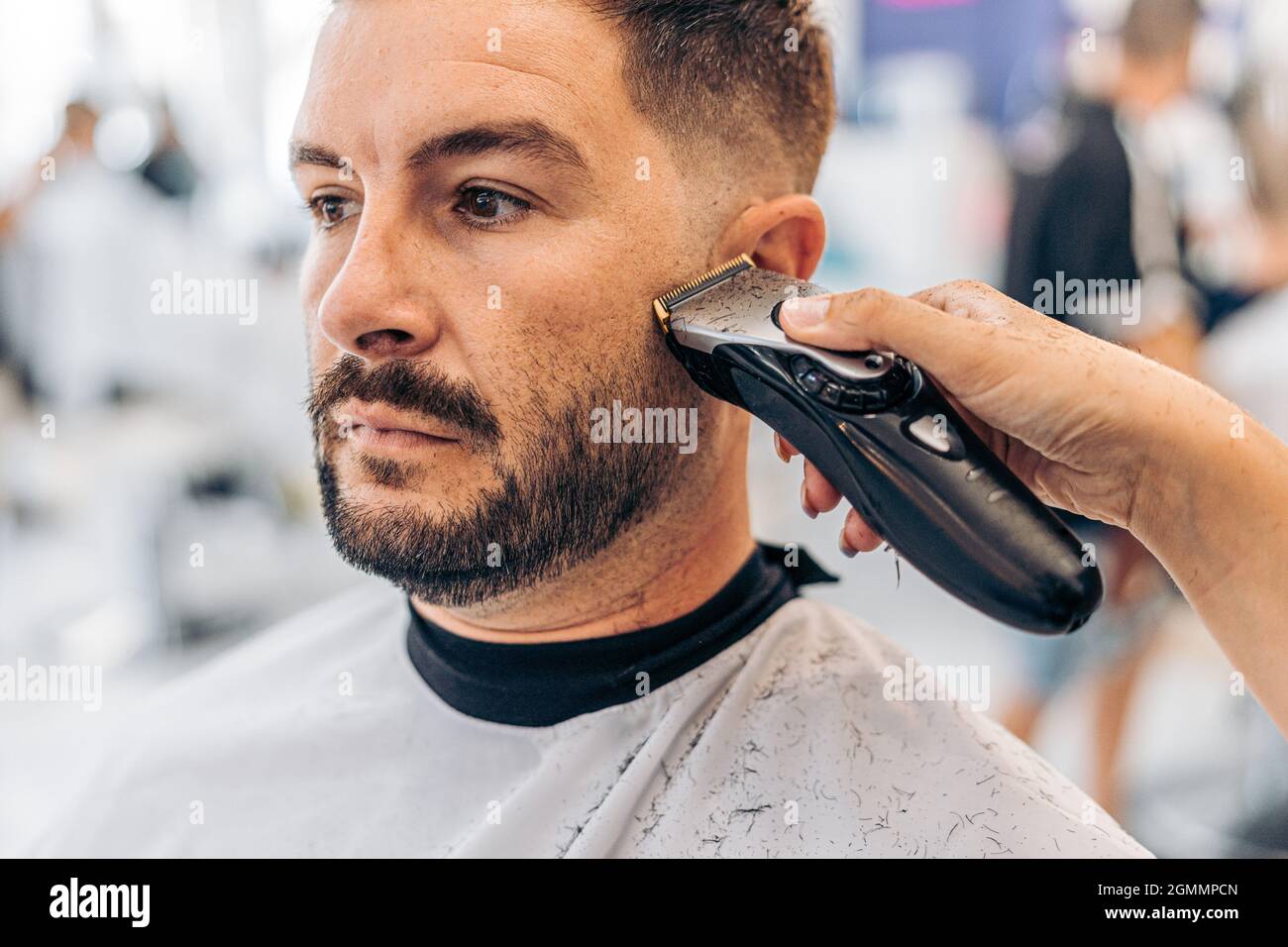 Portrait of a man being shaved in a barbershop Stock Photo