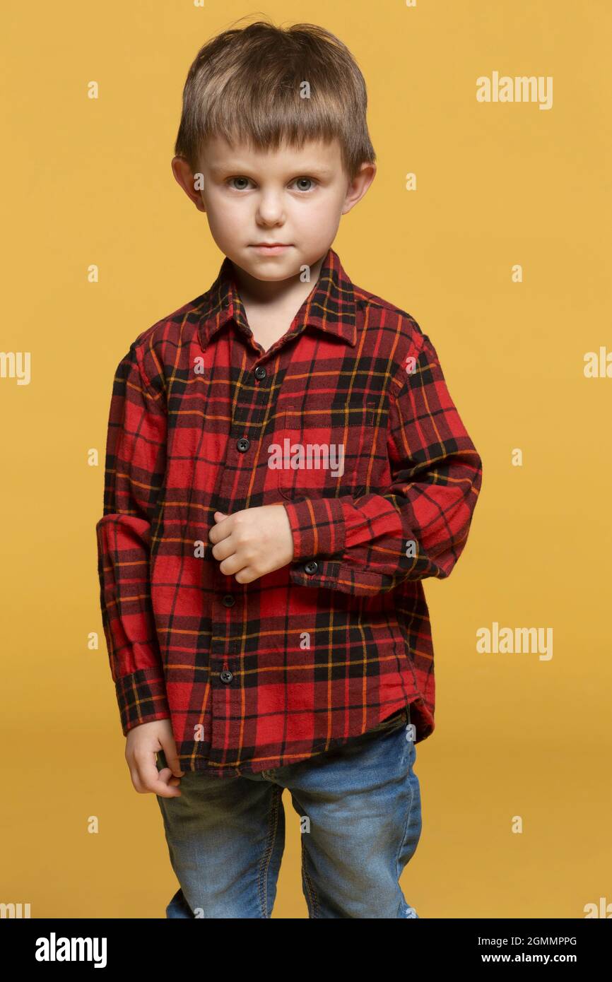 Portrait serious boy in plaid shirt Stock Photo