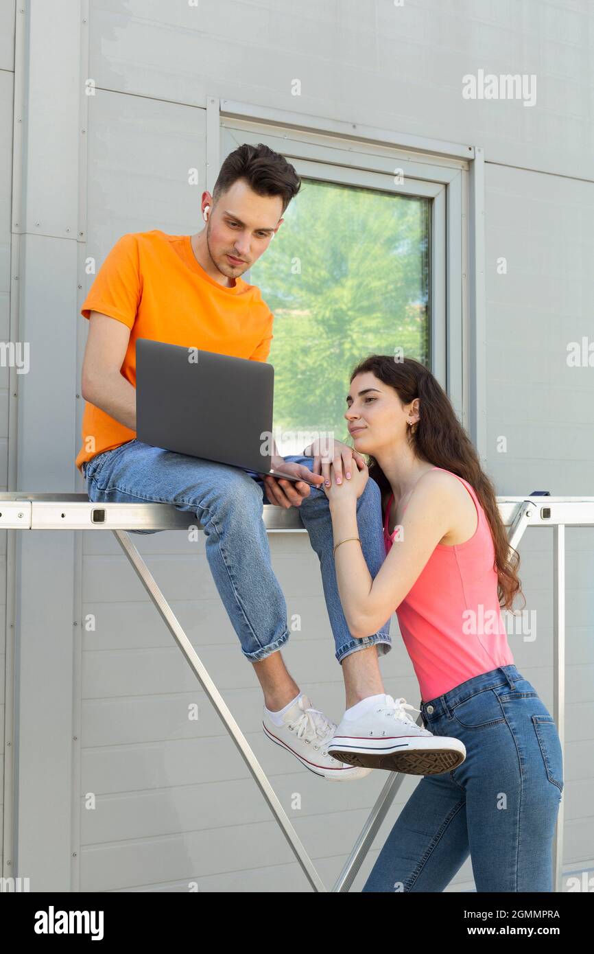 Young couple using laptop Stock Photo