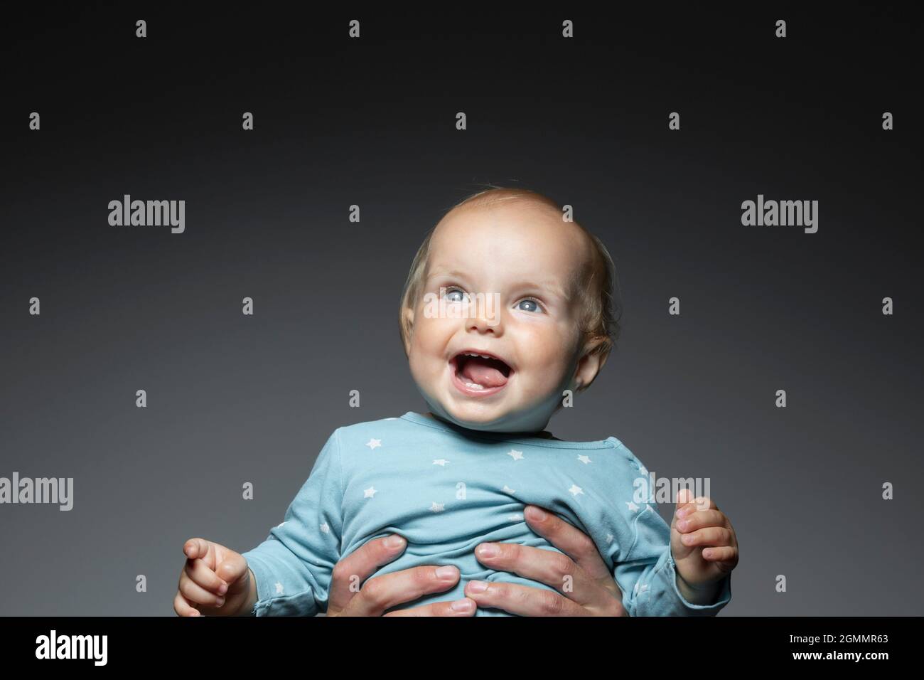 Portrait happy cute baby boy looking up Stock Photo