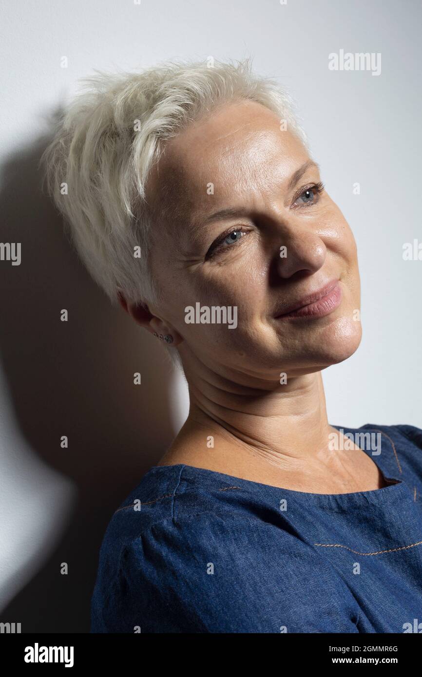 Portrait beautiful mature woman with short hair smiling Stock Photo