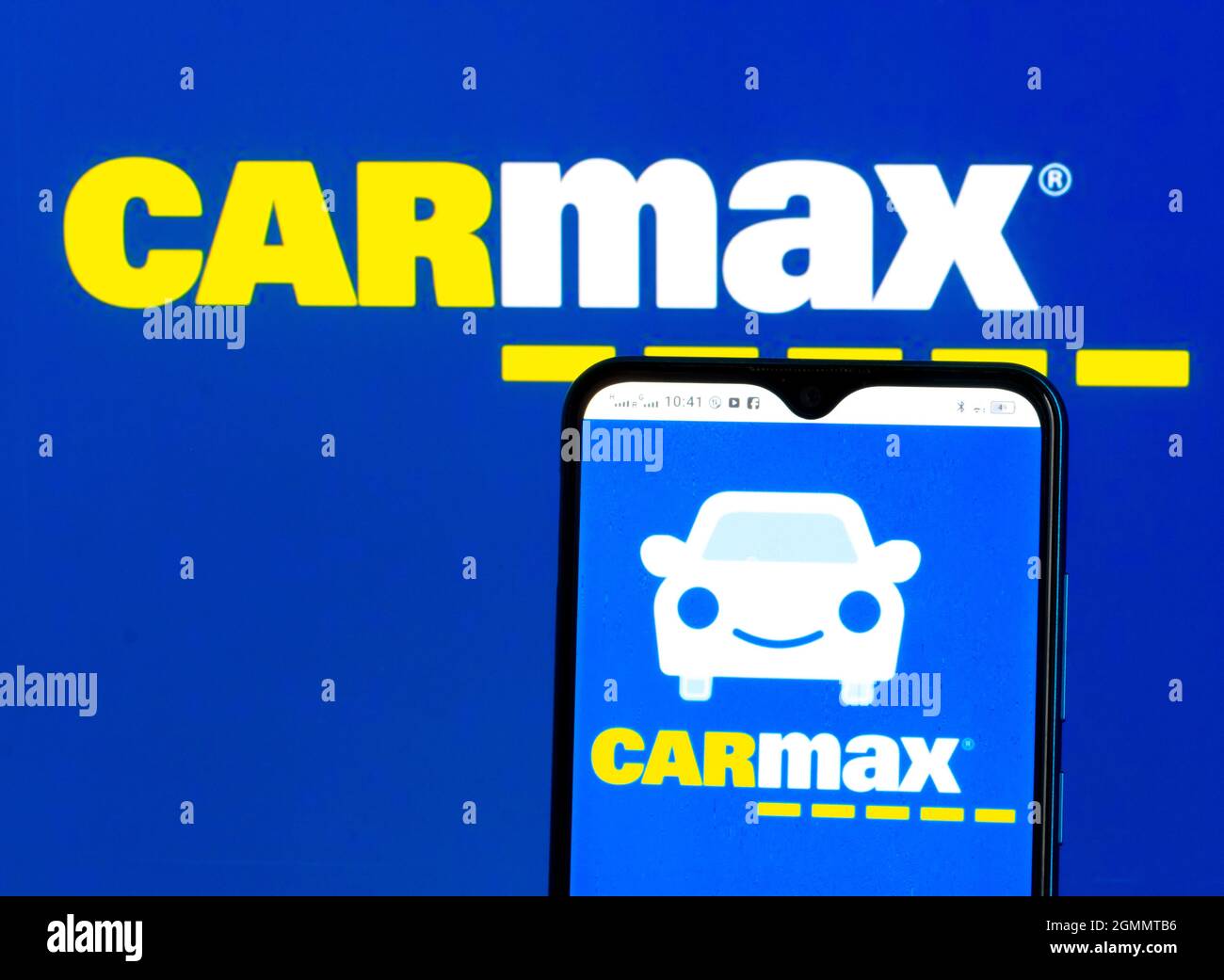 In this photo illustration CarMax, Inc. logo seen displayed on a