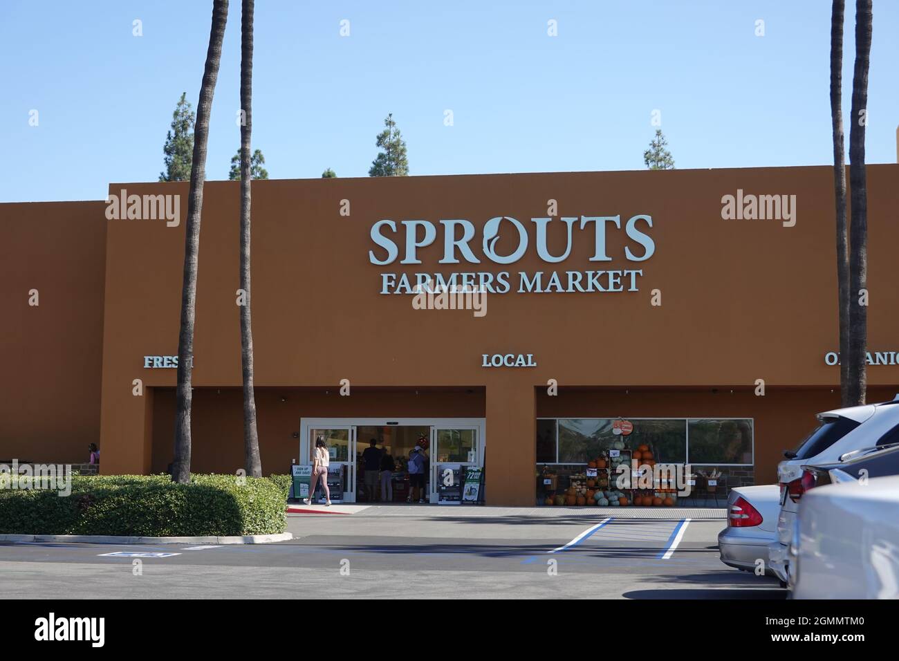 Sprouts neighborhood farmers market grocery store front and logo in