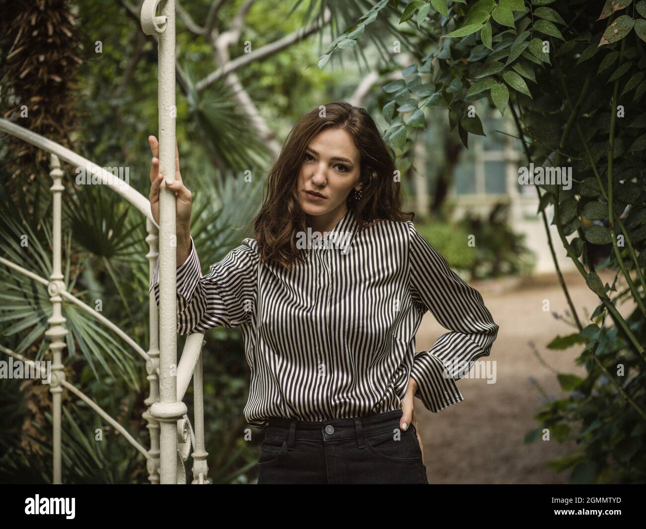 Girl posing in a greenhouse Stock Photo - Alamy