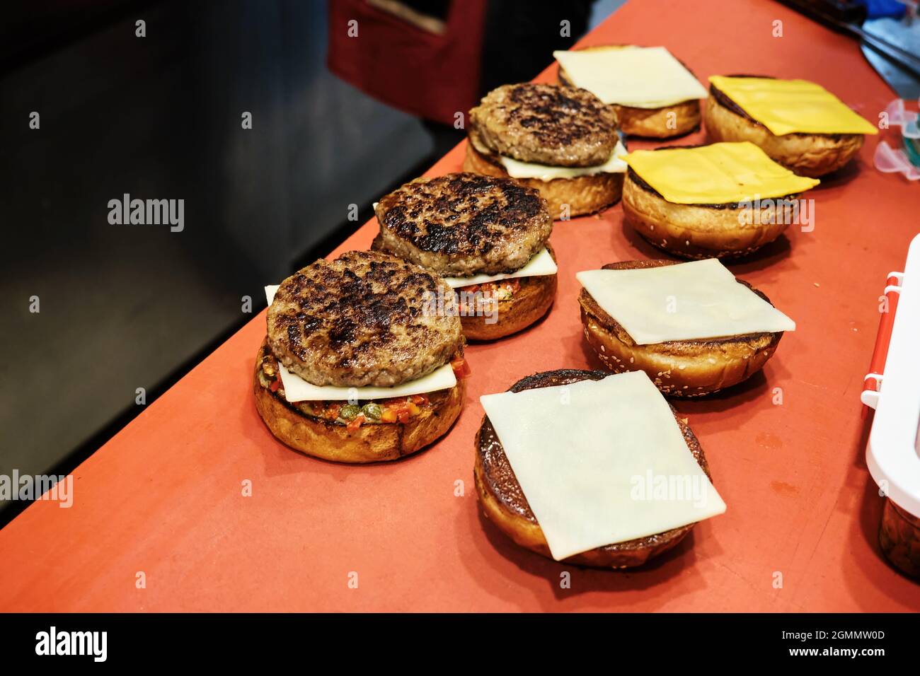 Hamburgers with grilled meat, bread and cheese are on the fast food