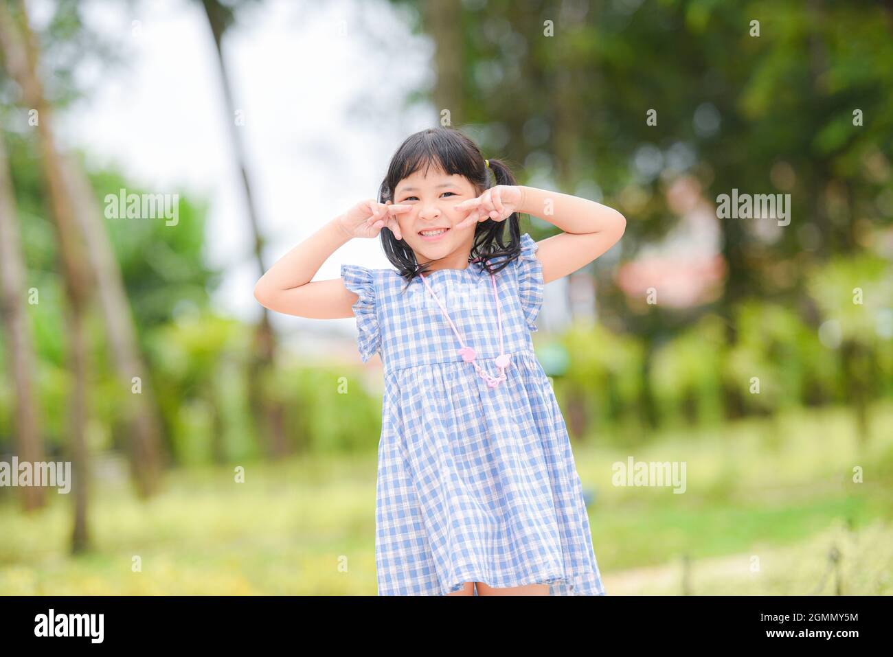 Asian kid girl happy in the park garden tree background, Beautiful ...