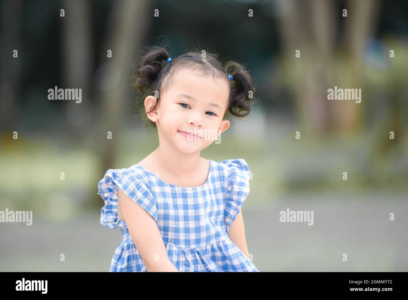 Asian kid girl happy in the park garden tree background, Beautiful ...