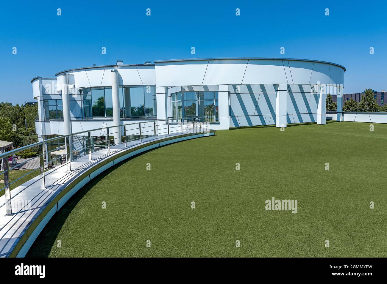 Stylish mansion with terrace on roof of first floor covered with green