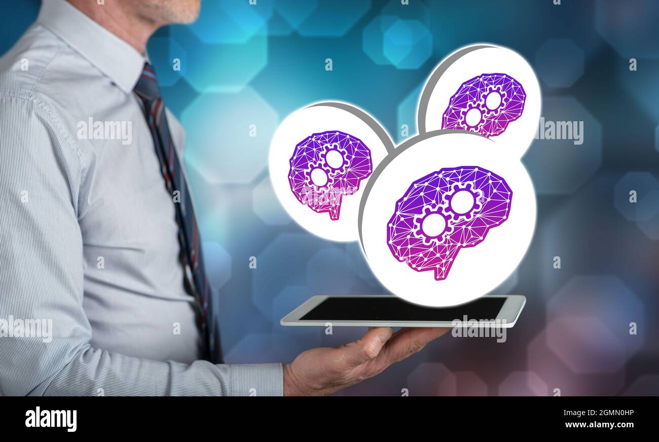 Deep learning concept above a tablet held by a man Stock Photo