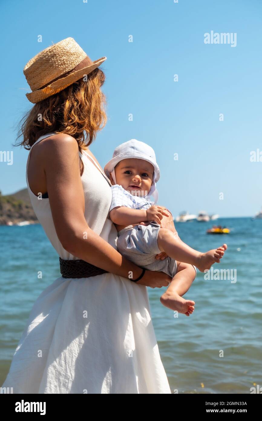 Mother with her baby in Cala Montjoi beach of the Cap Creus Natural Park,  Gerona, Costa Brava Stock Photo - Alamy